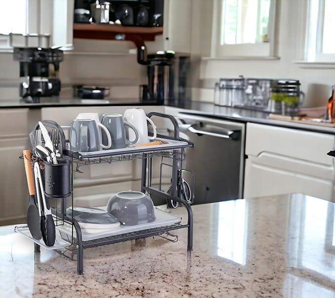 Black dish rack on a marble kitchen island