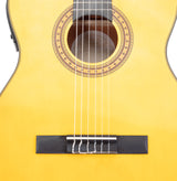 Detailed view of the body and strings of an acoustic guitar