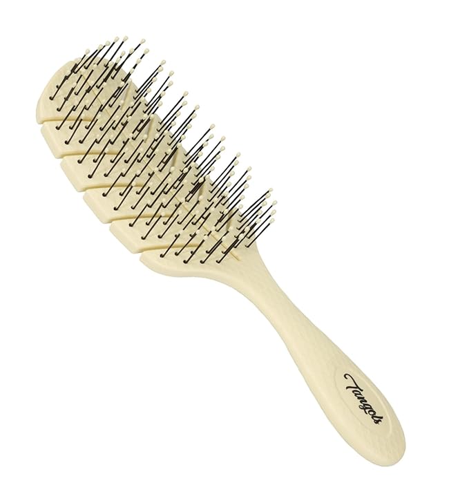 Beige hairbrush with ventilated design and metal bristles