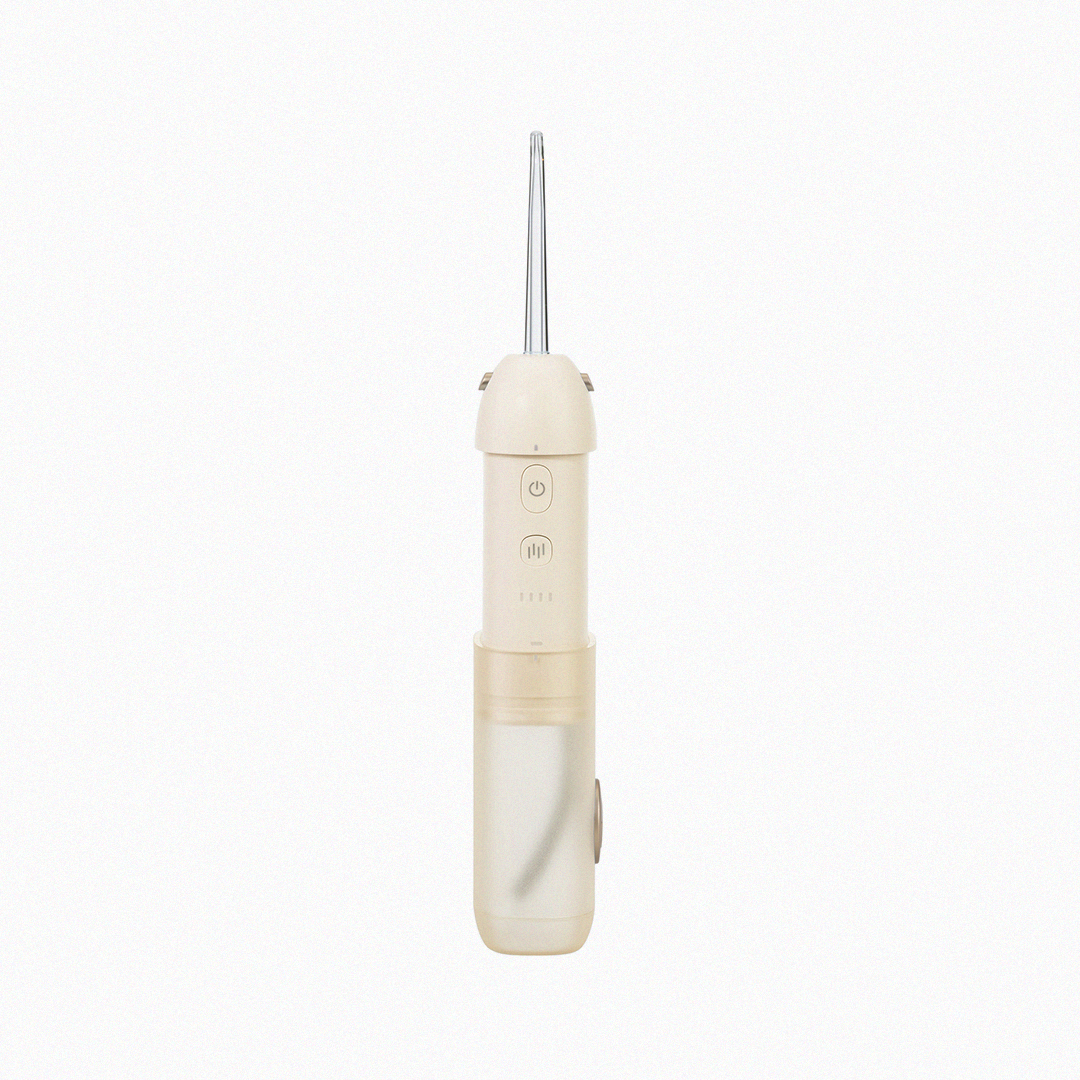 Front view of cream-colored Epsilon water flosser