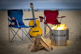 Fahrenheit fire pit on a beach with chairs and guitar