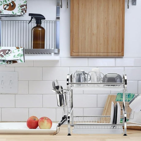 Stainless steel dish rack on a kitchen counter with utensils