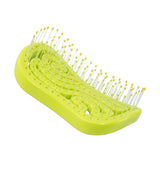 Neon green Tangols hairbrush with flexible bristles