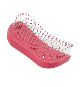 Red ventilated hairbrush with flexible plastic bristles