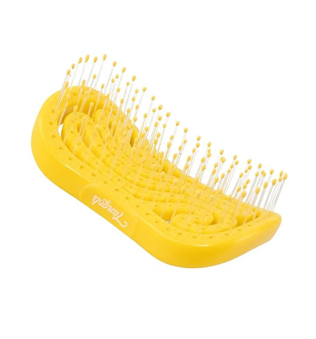 Bright yellow hairbrush with ventilated design and flexible bristles